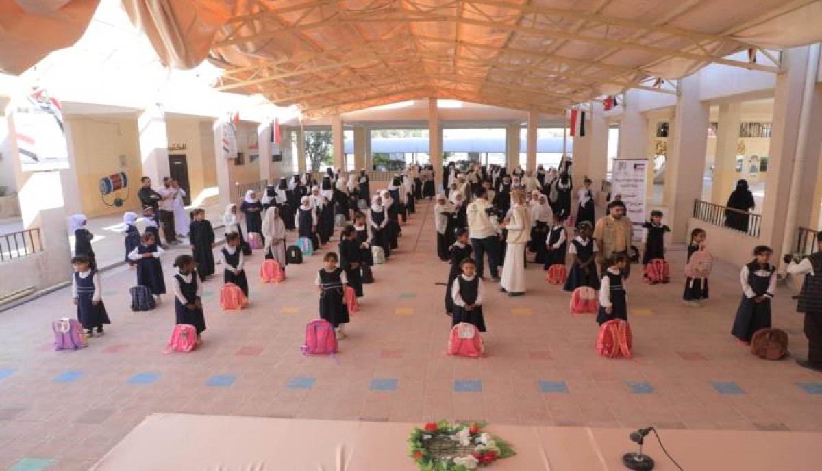 With Kuwaiti support, distributing school bags at Aisha Girls School in Al-Mahra