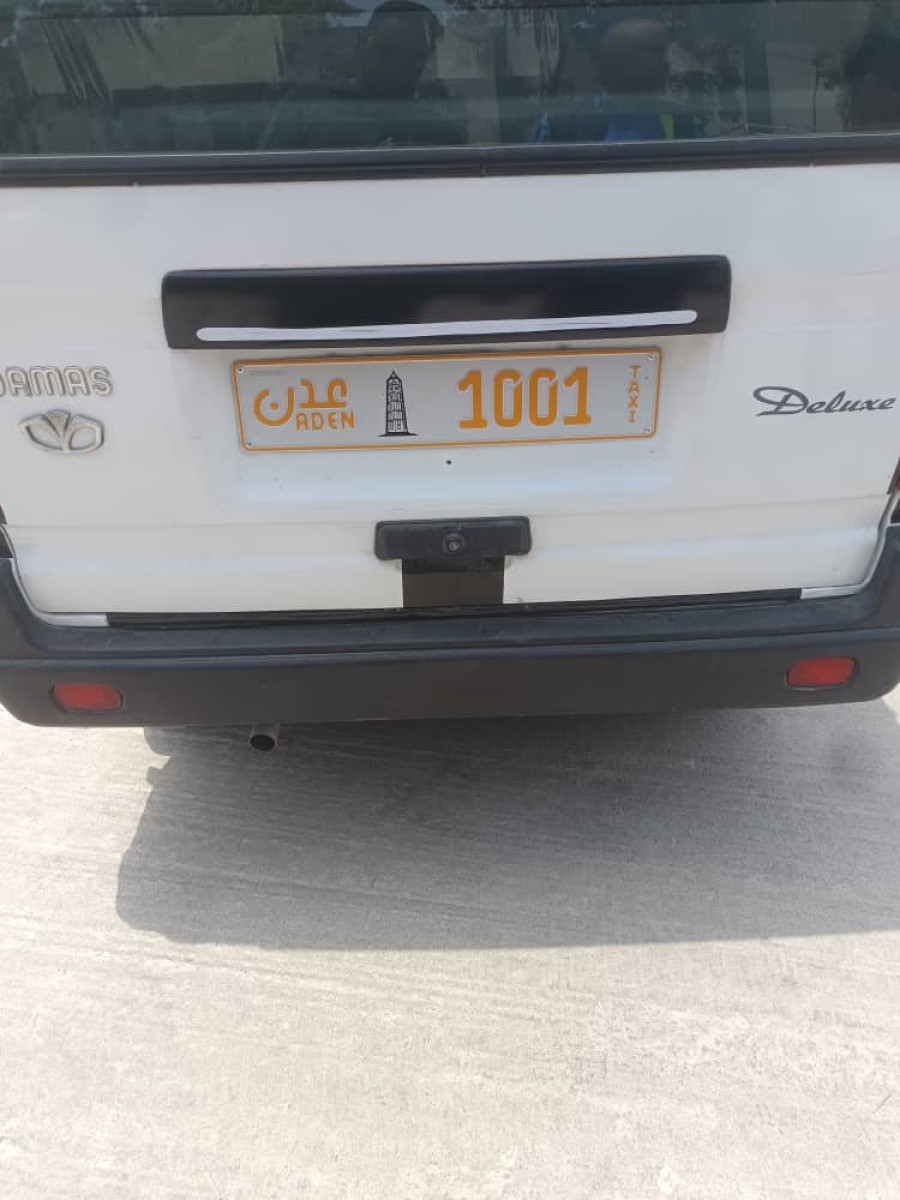 Aden.. Taxi buses are numbered with new metal plates