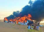 A fire engulfs a public transport bus on the Ma'rib road